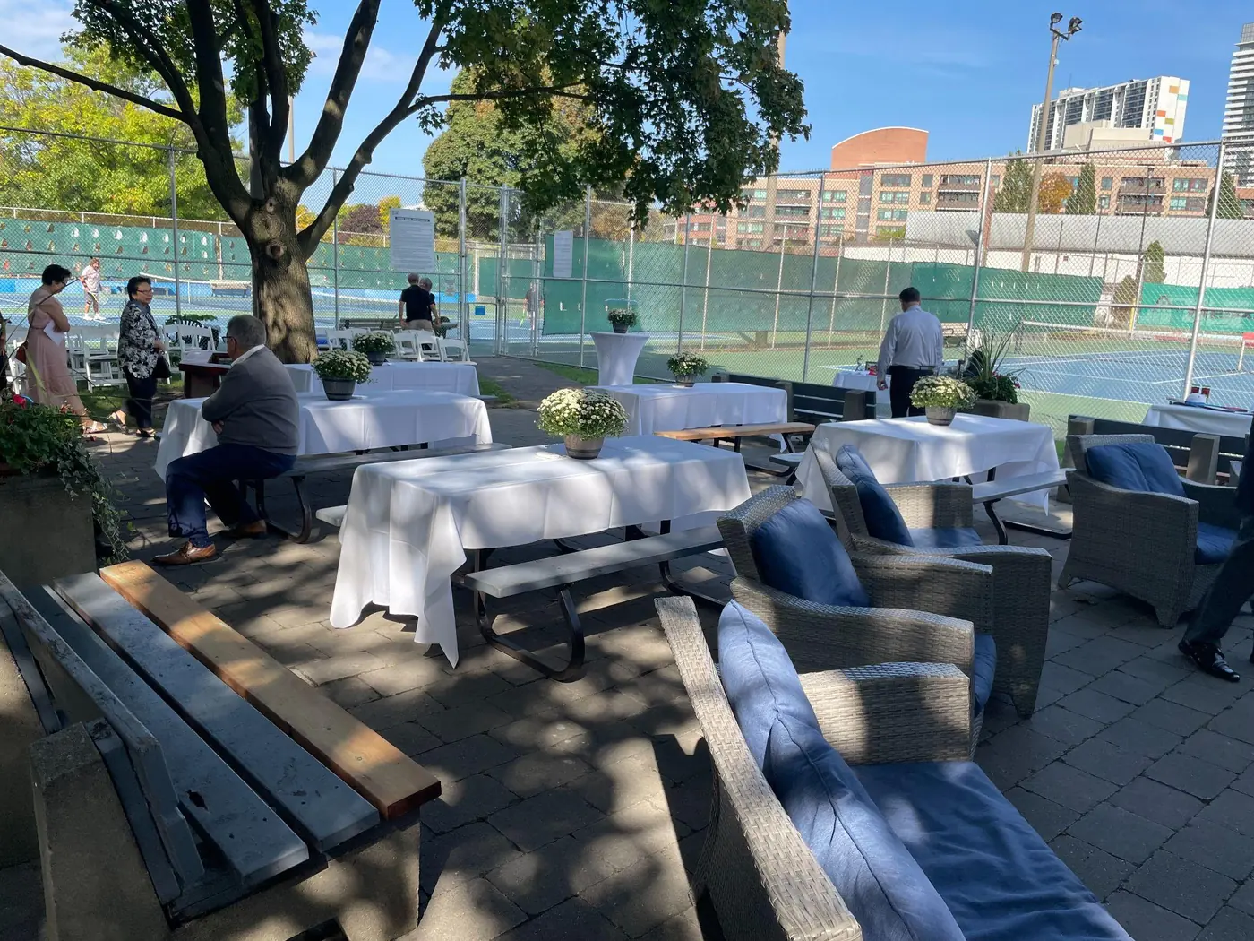Celebration of Life venue setup with flowers and personal details in Toronto